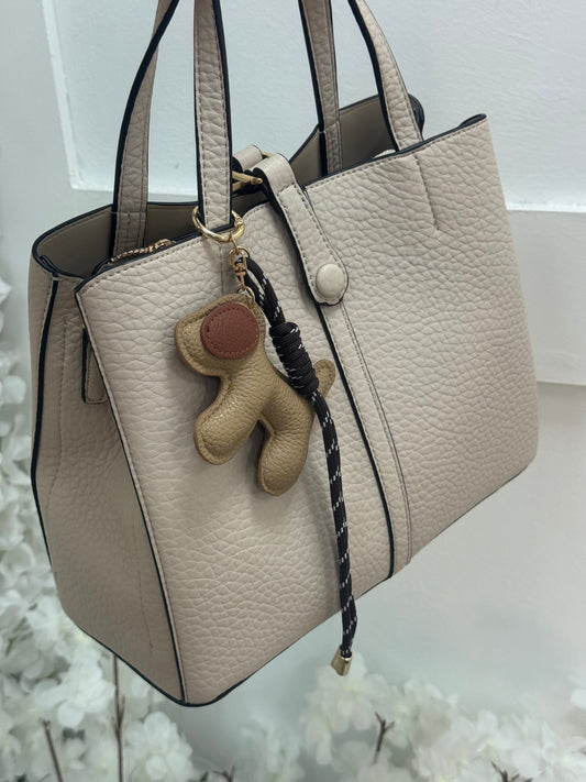 Trixi: Cream handbag with dog keyring.