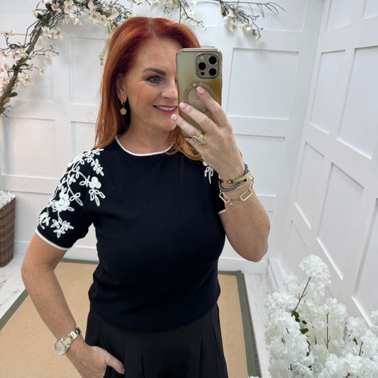 Henna: Black stretchy knit embroidered top. 2 sizes