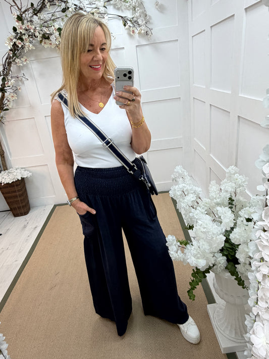 Candi: Navy shirred waist wide leg pocket trousers. One size: 10-18
