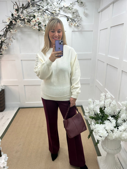 Crystal: White sequin embellished knit top. One size: 14-20