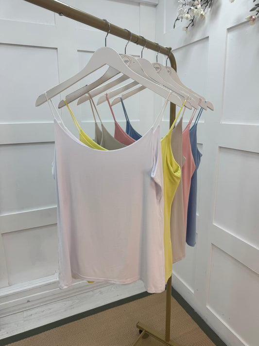 Velma: White stretchy vest top. One size: 14-18