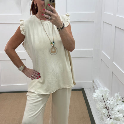 Ember: Cream frill sleeve top & pendant. One size: 14-20