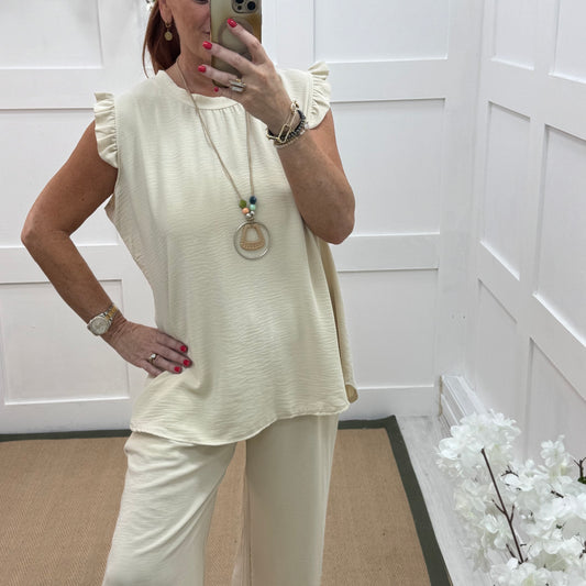 Ember: Cream frill sleeve top & pendant. One size: 14-20