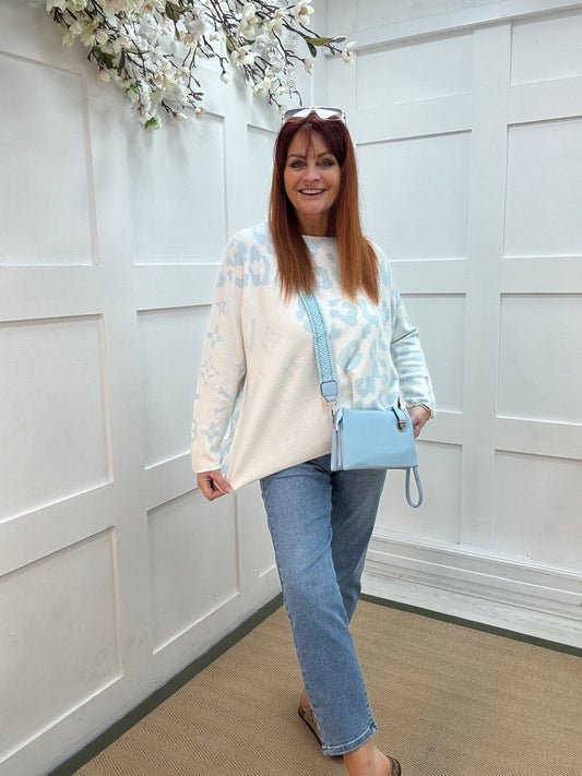 Alice: Blue & white leopard print top. One size: 12-20