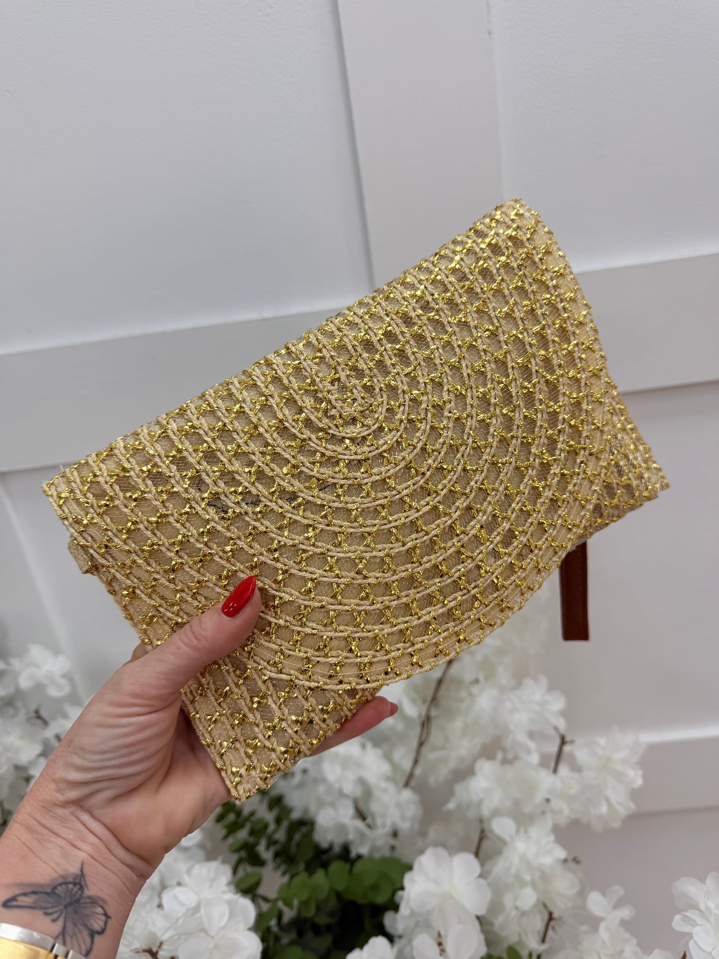 Solara: Gold raffia wristlet clutch bag