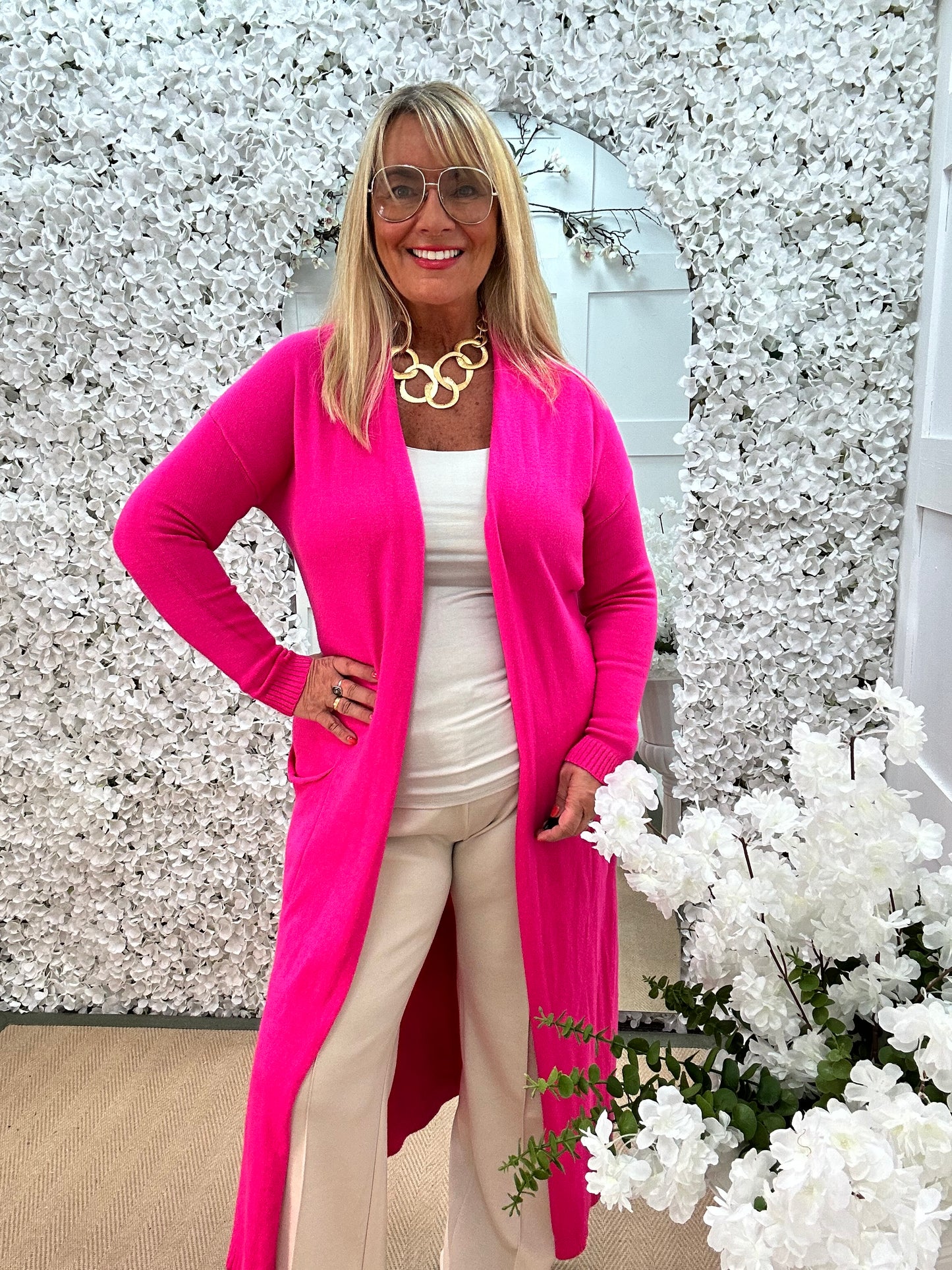 Marley: Pink plain longline pocket cardigan. One size: 12-18