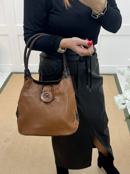 Pipa: Brown slouchy big button shoulder bag.