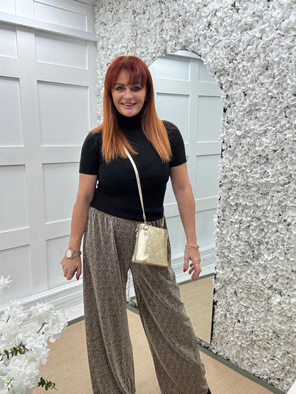 Sandy: Gold lurex wide leg trousers. One size: 12-18