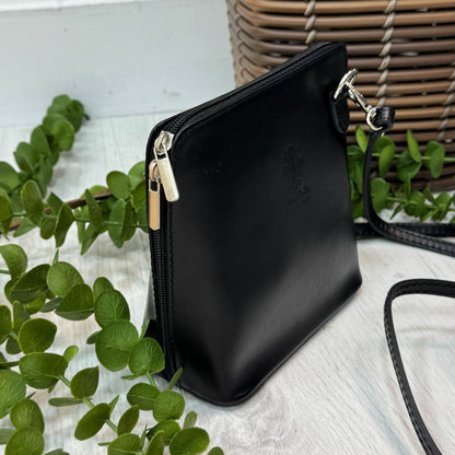 Thea: Black leather cross body/clutch bag.