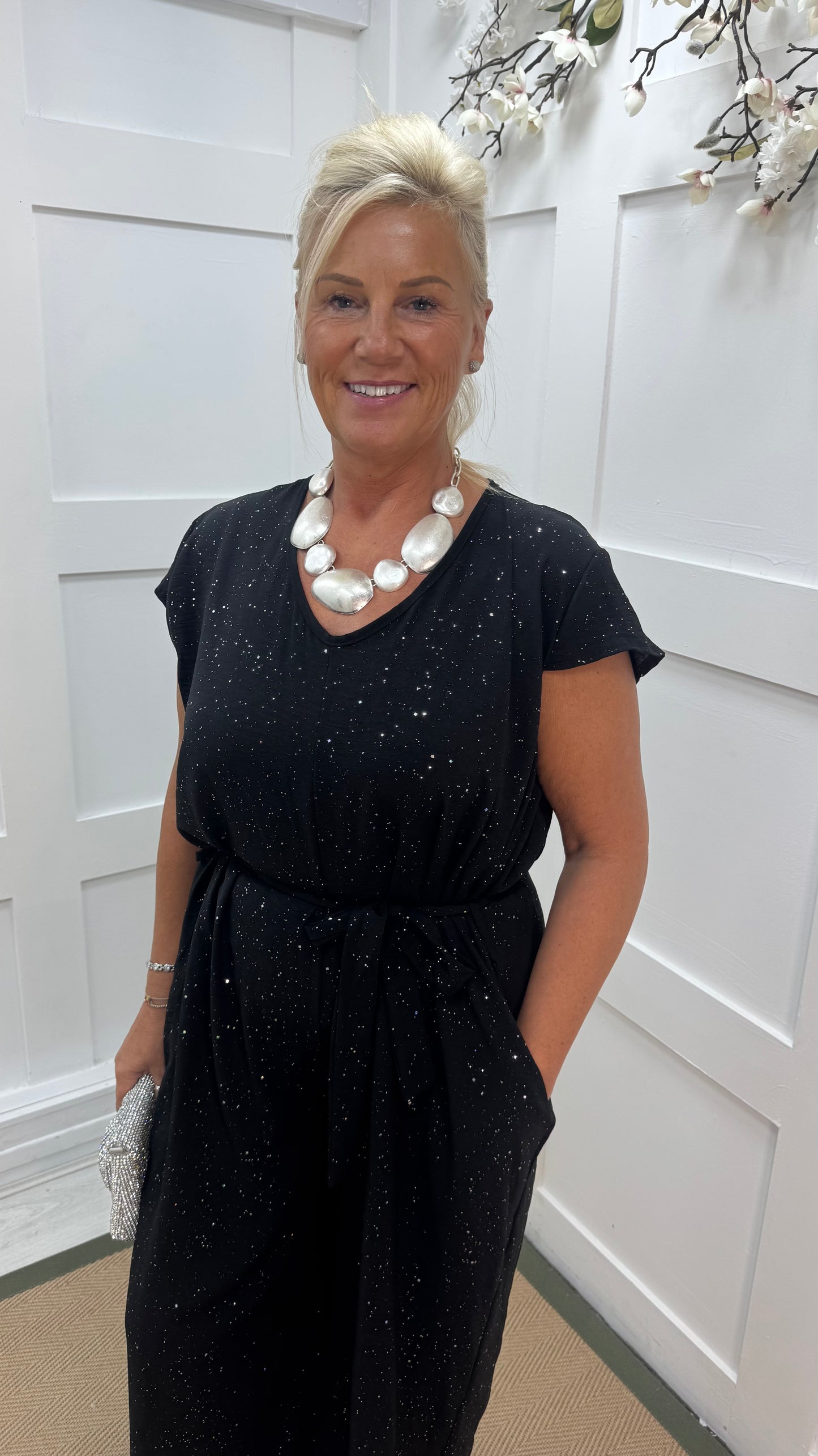 Gia: Black sparkle tie-waist wide leg jumpsuit. One size: 12-18