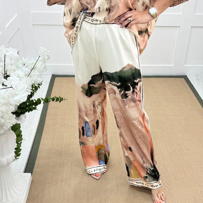 Sophia: Cream silk Amalfi wide leg trousers. One size: 10-16