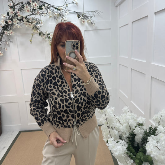 Ursula: Beige leopard print zipped neck top. One size: 12-18