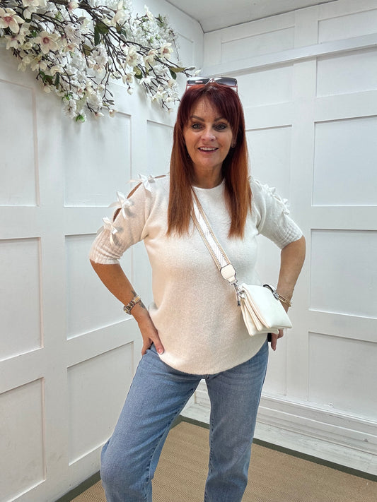 Capri: White bow sleeve knitted top. One size: 10-14/16