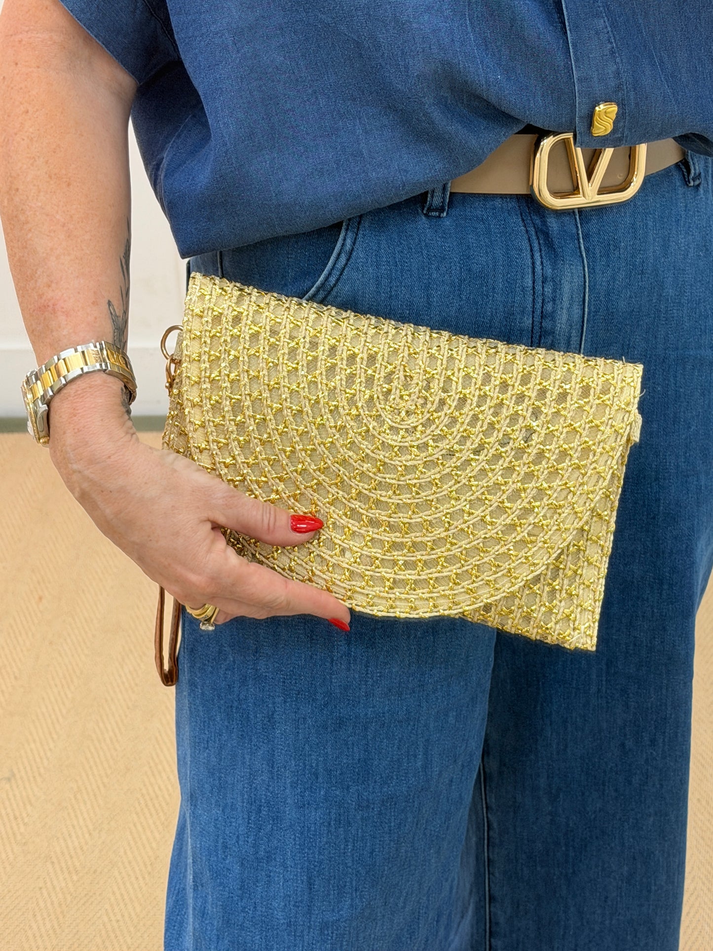 Solara: Gold raffia wristlet clutch bag