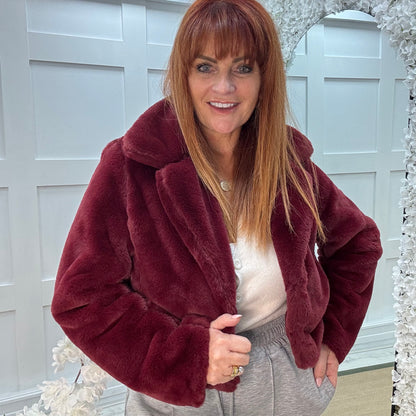 Paula: Burgundy short faux fur jacket . One size 10-16