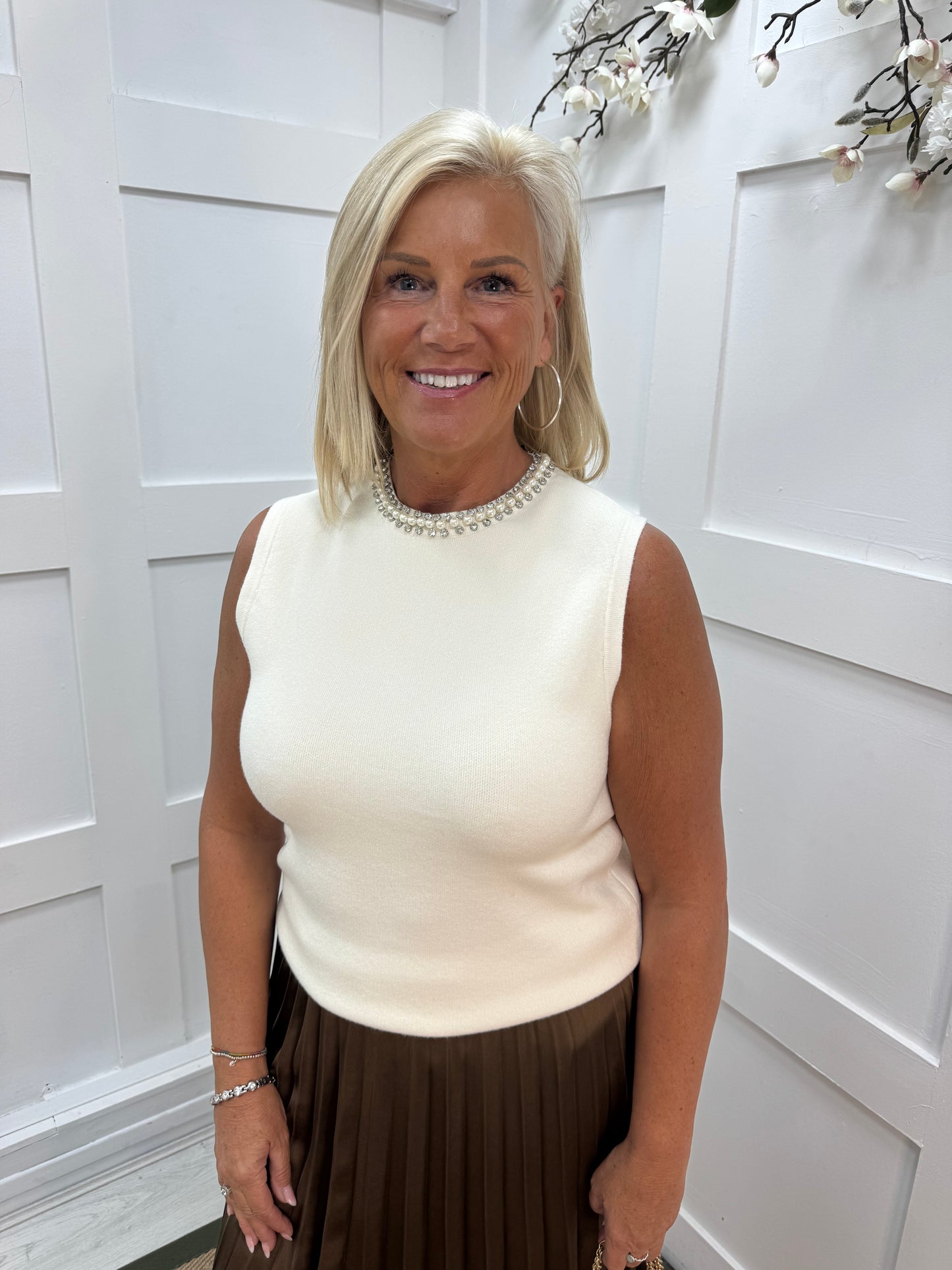 Raven: Winter white rhinestone sleeveless top. One size: 12-16