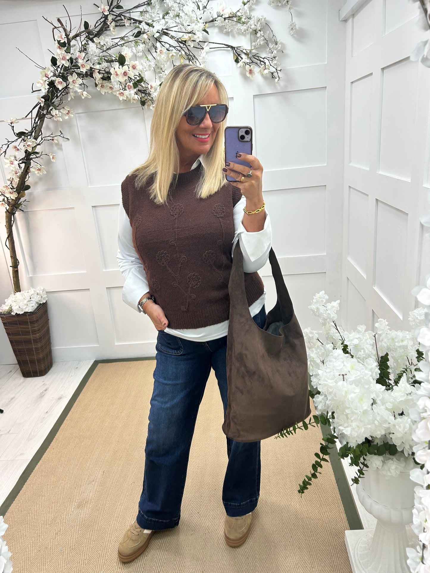 Larry: Brown sleeveless tank top with flower detail. One Sz: 12-18