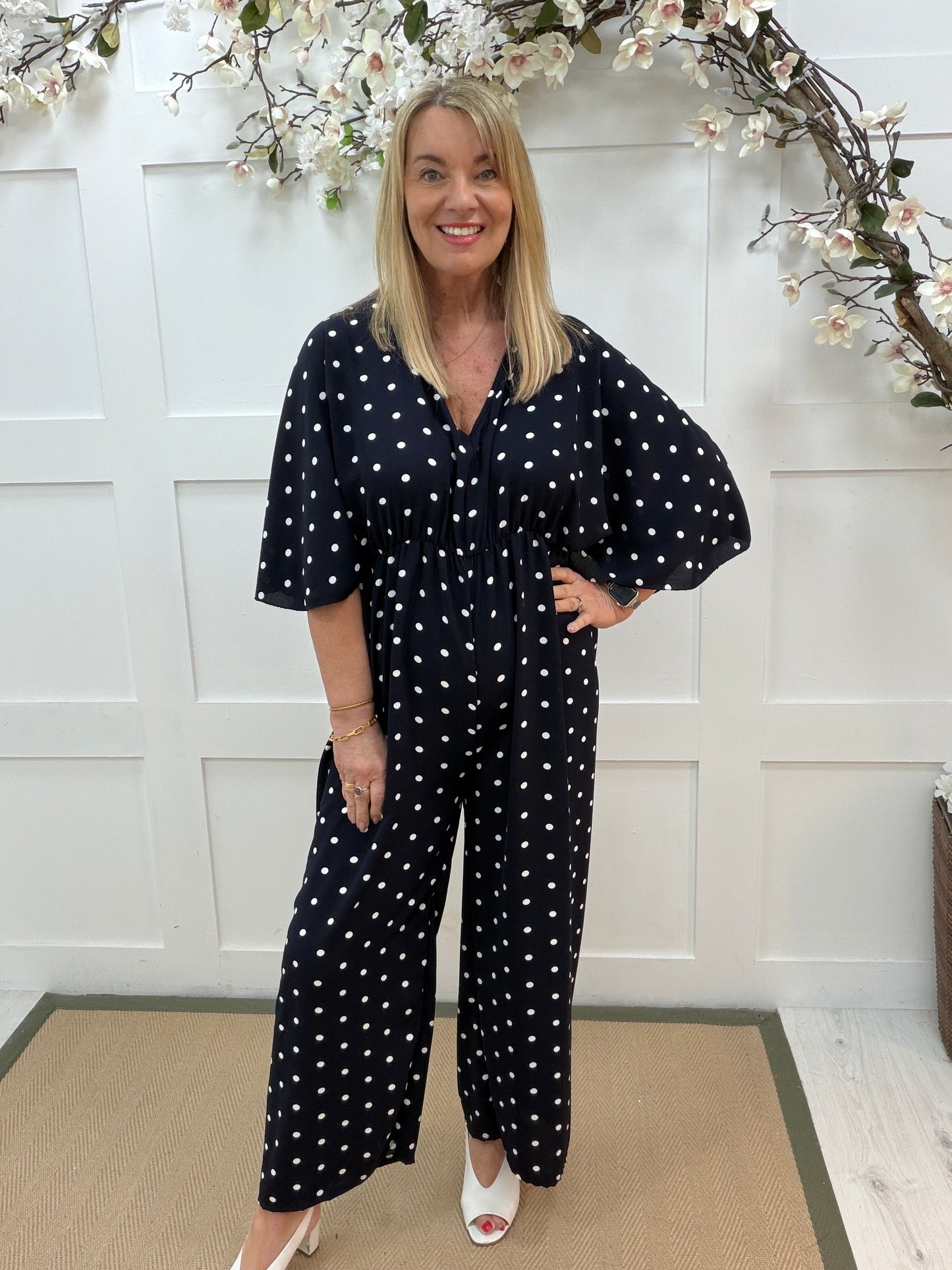 Amalia: Navy and white spotty wide leg jumpsuit. One size: 14-18