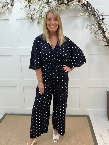 Amalia: Navy and white spotty wide leg jumpsuit. One size: 14-18