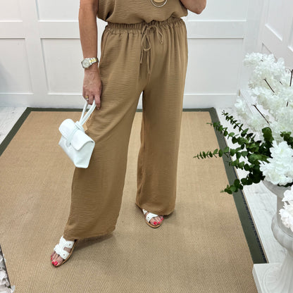 Esme: Sand pocket wide leg trousers. One size: 12-20