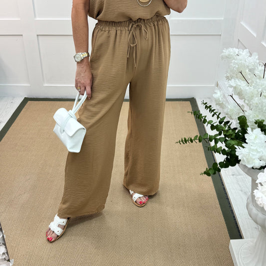 Esme: Sand pocket wide leg trousers. One size: 12-20
