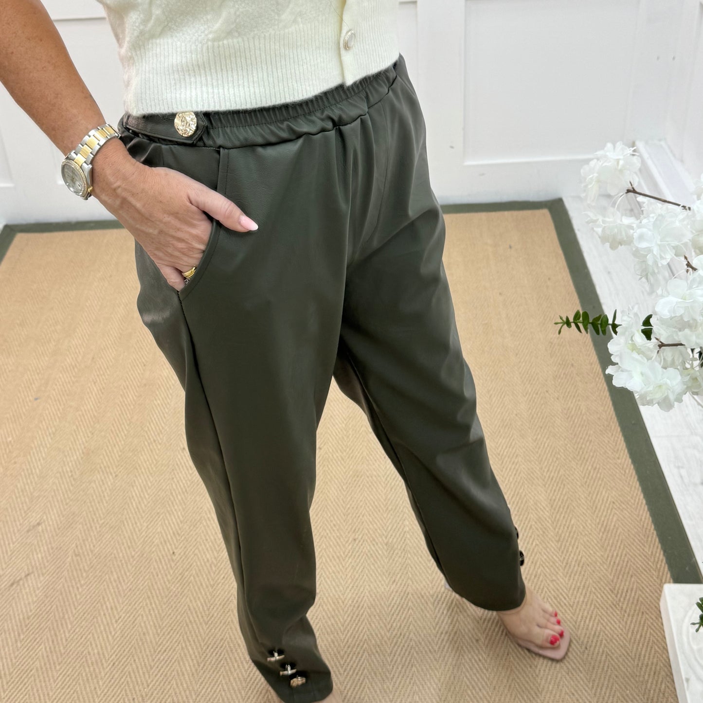 Tatum: Khaki faux leather button trousers. One size: 14-18