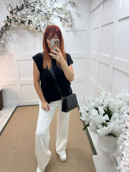 Neve: Basic black cotton T shirt. One size: 10-18