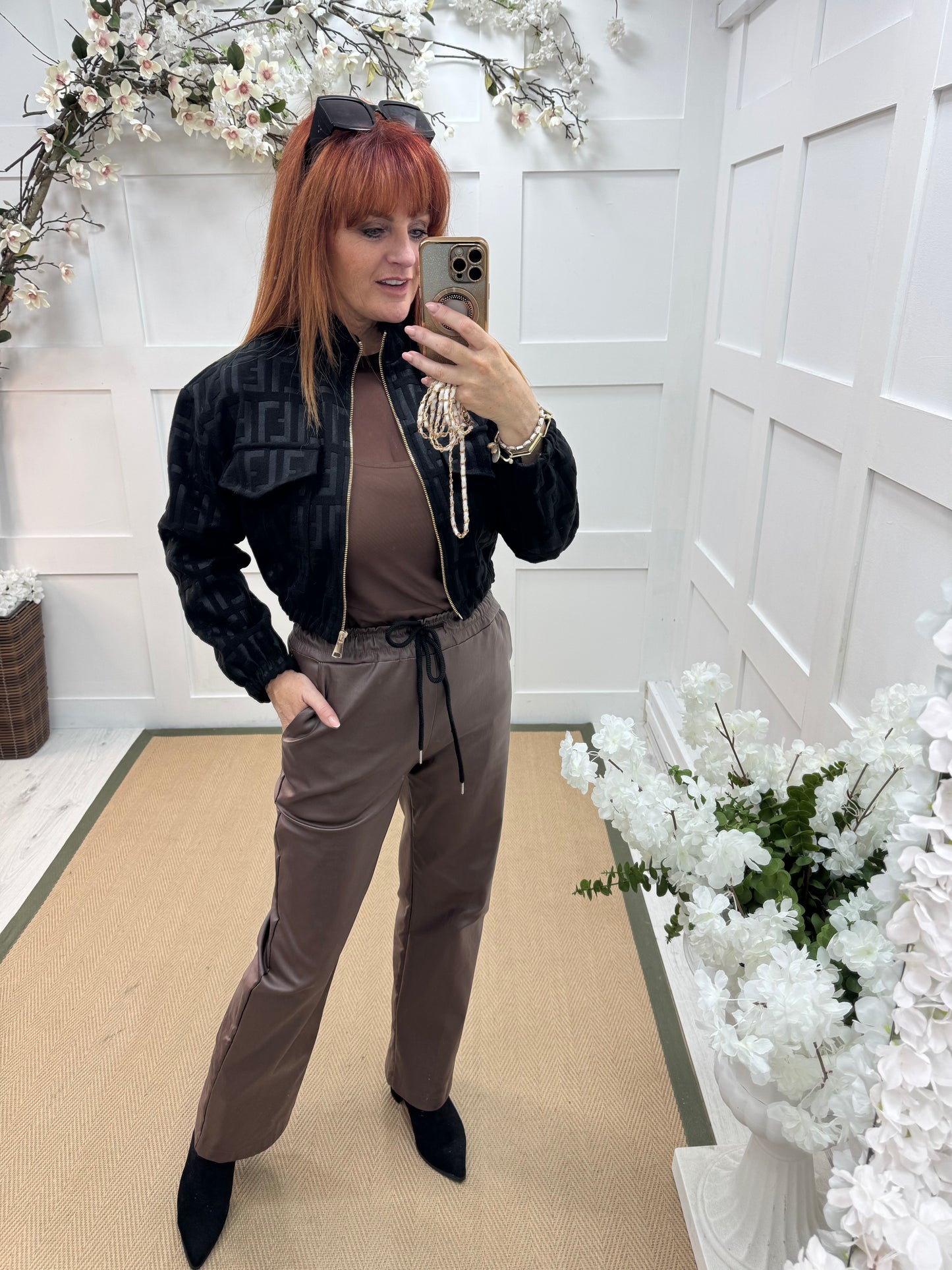 Quinn: Brown faux leather trousers. One size: 10-14