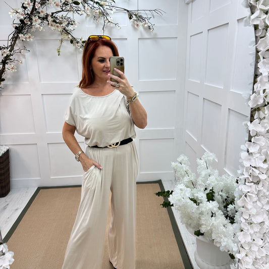Rhianna: Cream jersey draped wide leg jumpsuit. One size: 10-16