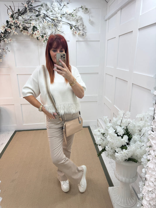 Honey: Cream fringe hem knit top. One size: 10-16