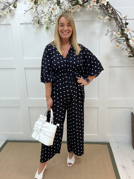 Amalia: Navy and white spotty wide leg jumpsuit. One size: 14-18