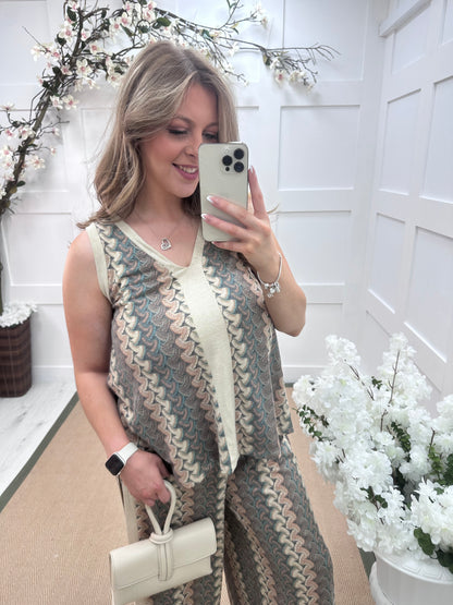 Pasha: Cream zigzag top & printed trouser co-ord set. One size: 12-18
