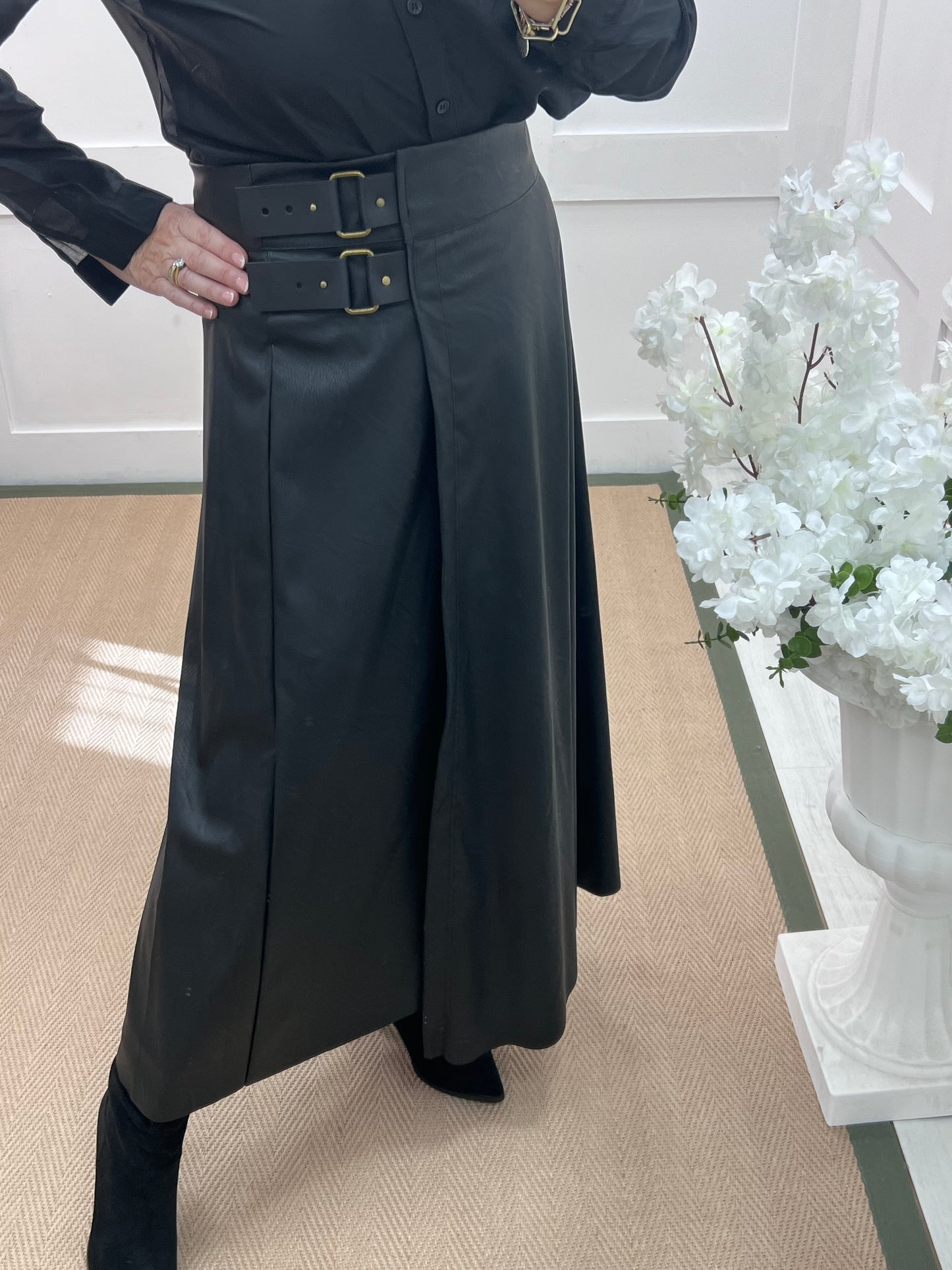 Raine: Black faux leather belted asymmetric skirt. One size: 12-16