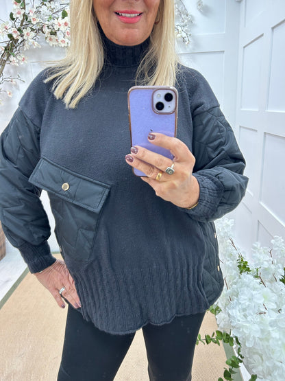 Harlo: Black quilted sleeve neck top. One Sz: 12-18