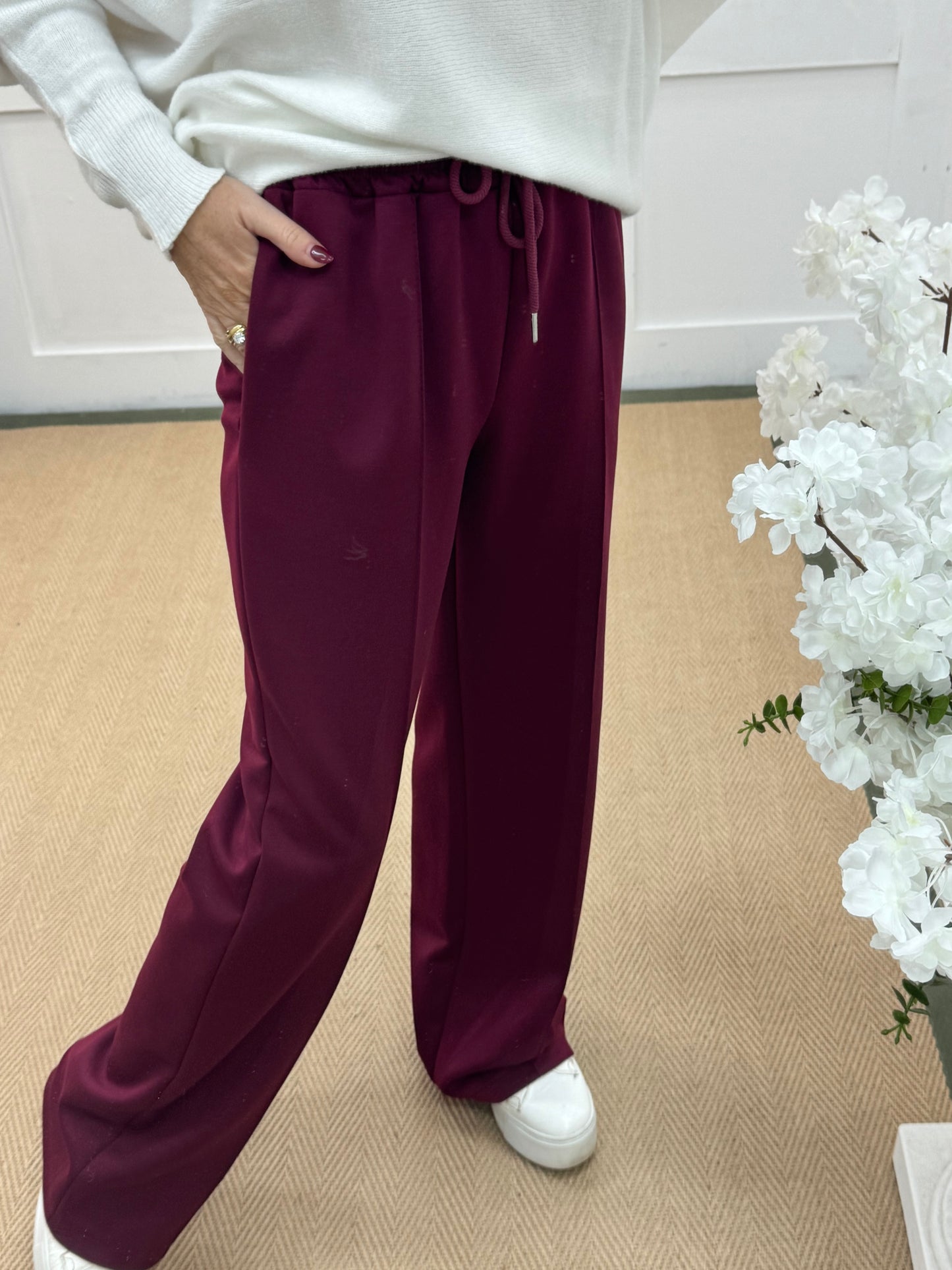 Trudy: Burgundy stretchy wide leg pocket trousers. 2 sizes