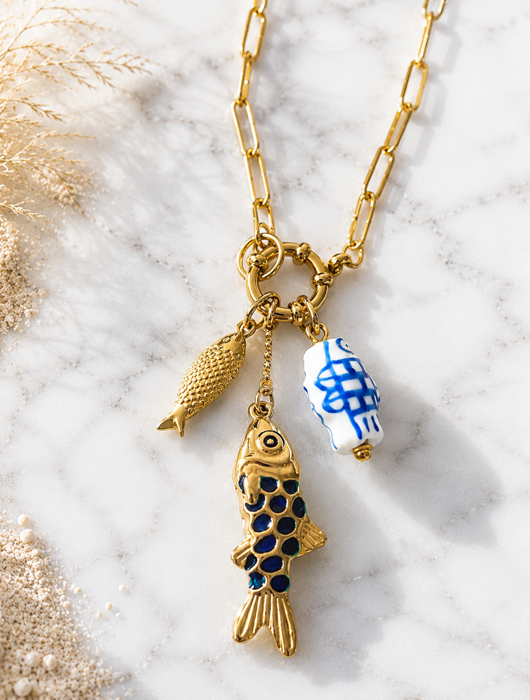 Dory: 18k gold plated multi fish necklace.