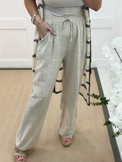 Tori: Cream cotton wide leg trousers. One size: 8-16