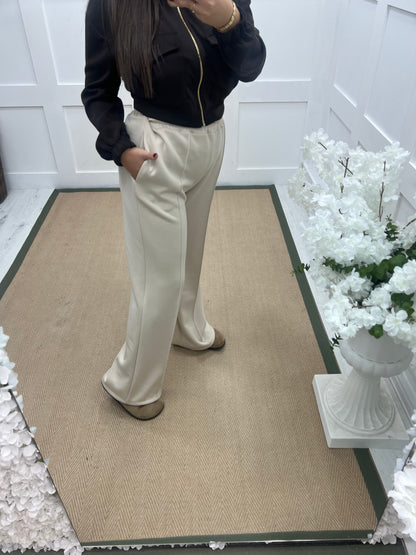 Trudy (Short): Cream stretchy wide leg pocket trousers. One size 10-16