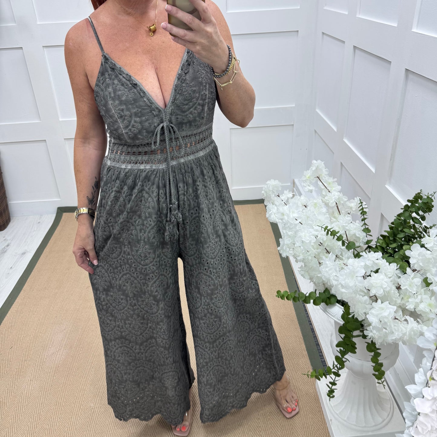 Bria: Grey broderie Anglaise strappy jumpsuit. One size: 10-14