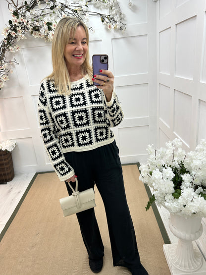 Carly: Black and cream long sleeve crochet top. One size: 14-18