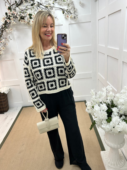 Carly: Black and cream long sleeve crochet top. One size: 14-18