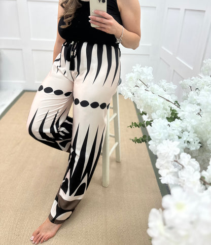Diana: Cream & black printed wide leg trousers. One size: 10-16