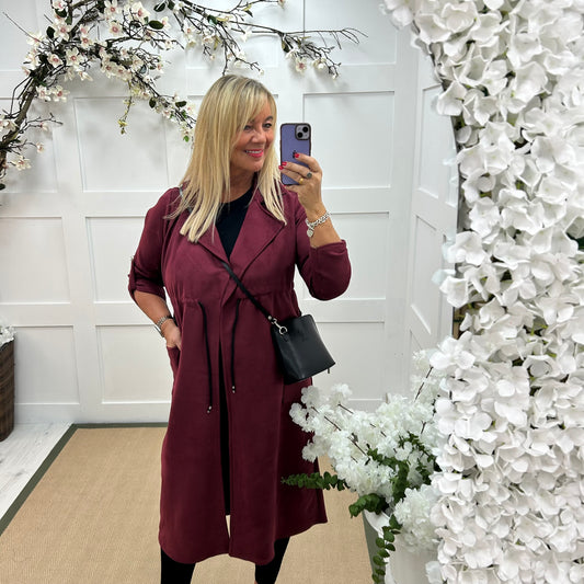 Marina: Burgundy long suedette trench coat. One size 12-18
