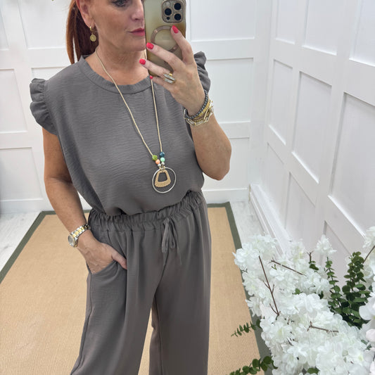 Ember: Taupe frill sleeve top & pendant. One size: 14-20