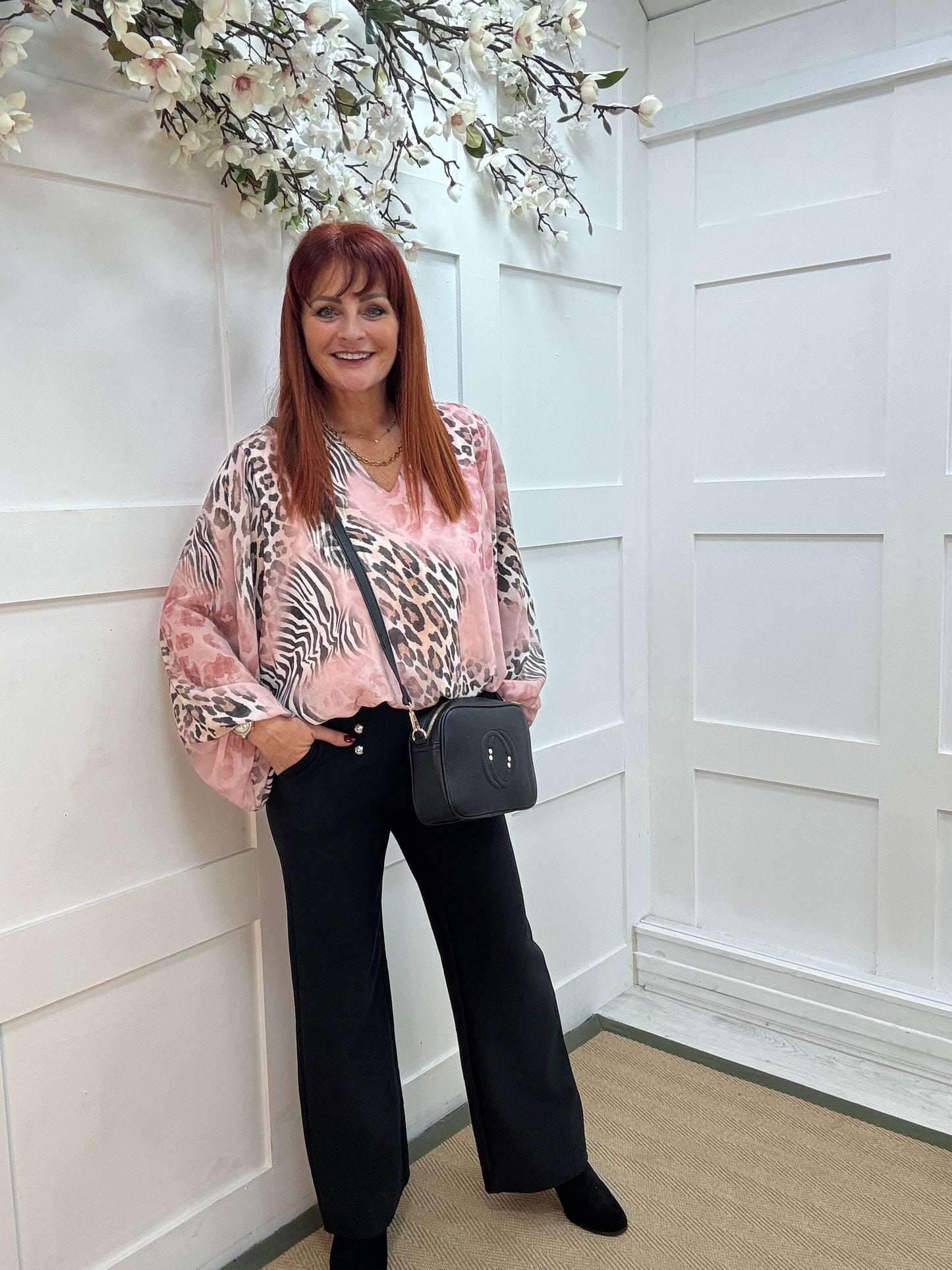 Vikki: Pink V neck animal print blouse. One size: 10-16