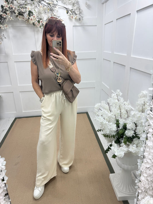 Esme: Cream pocket wide leg trousers. One size: 12-20