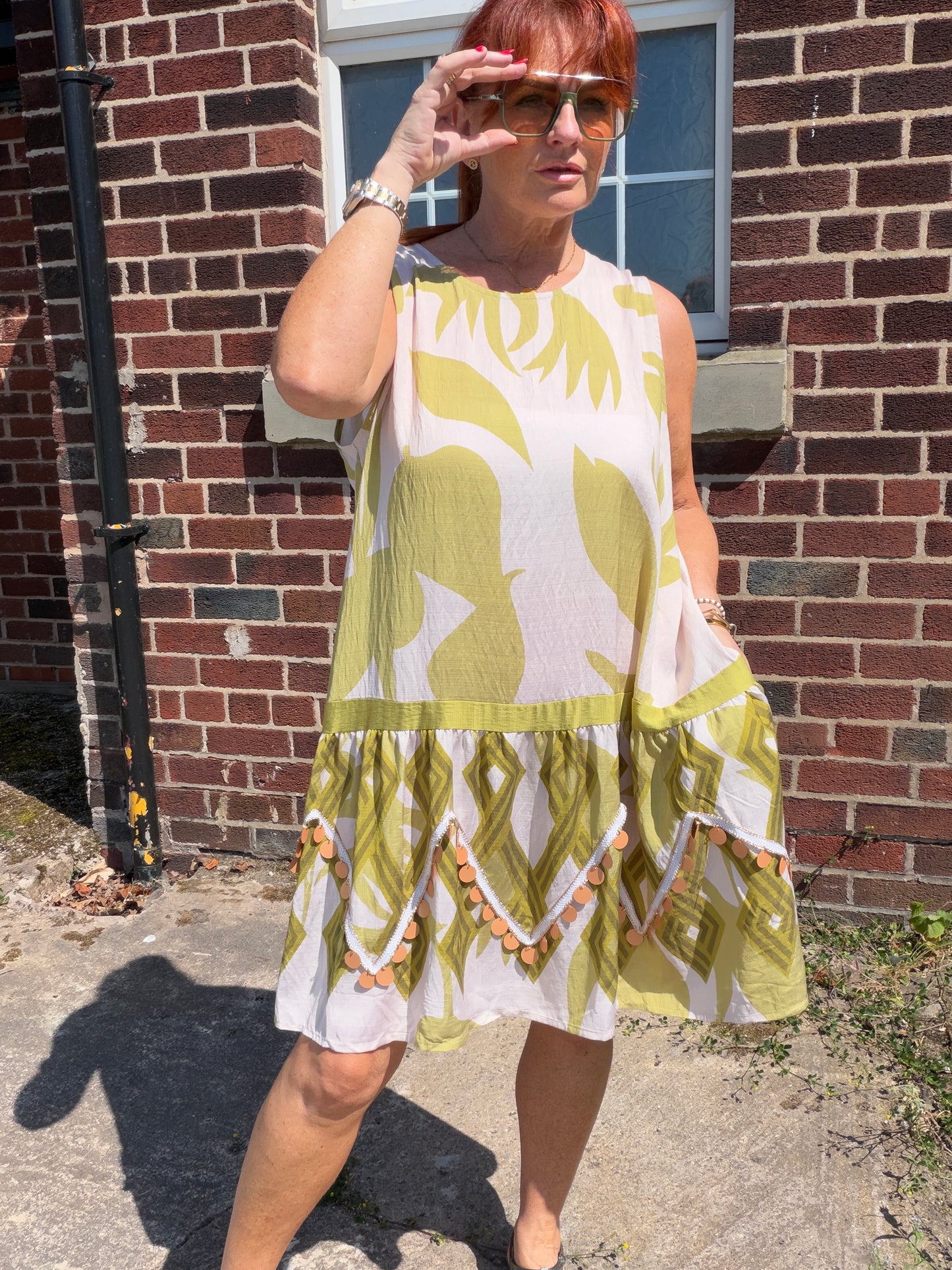Molly: Leaf printed midi dress with large disc detail. One size: 12-18. 2 colours