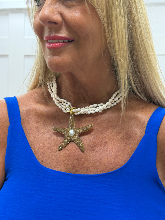 Starri: White & gold beaded starfish and shell statement necklace.
