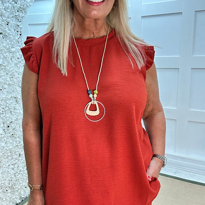 Ember: Orange frill sleeve top & pendant. One size: 14-20