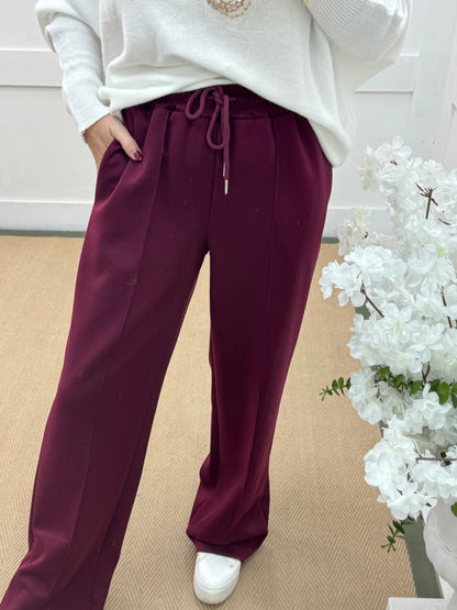 Trudy: Burgundy stretchy wide leg pocket trousers. 2 sizes